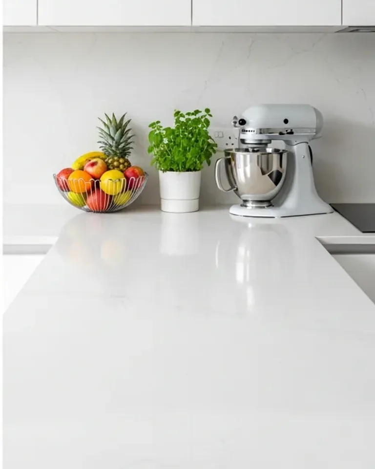 The same kitchen counter, clear and polished, after a Kiwi Cleaning visit